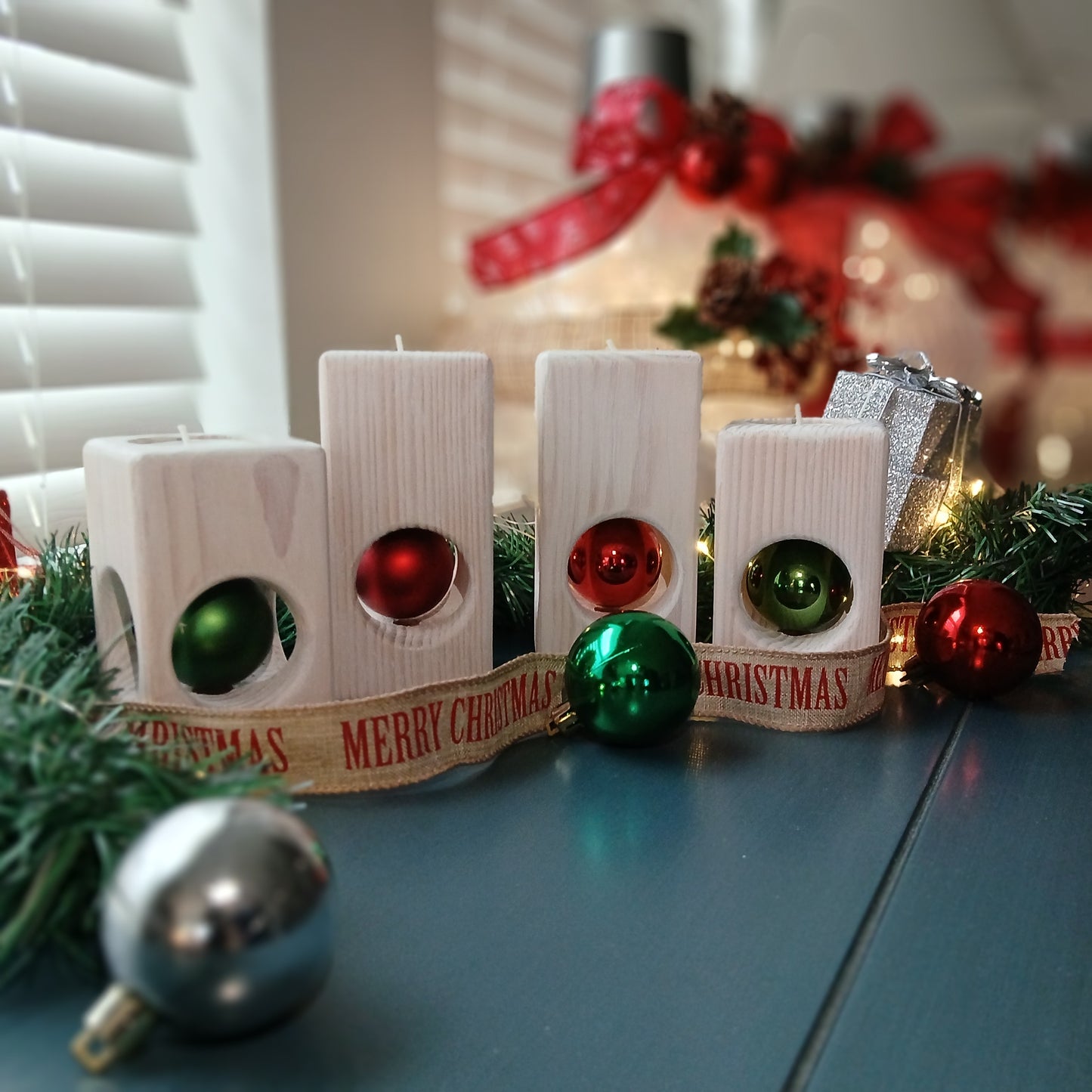 A set of two white-washed tealight holders with Christmas ornaments.
wooden tealight holders